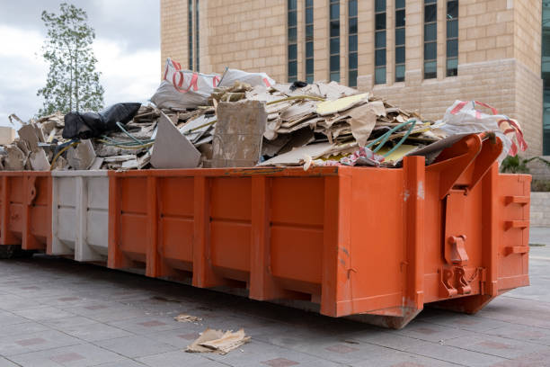 Rubbish removal service clearing unwanted debris from Jensen Beach property<br />
