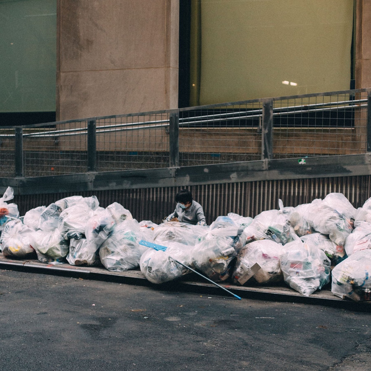 Bags of residential waste prepared for dumpster disposal in Stuart, FL
