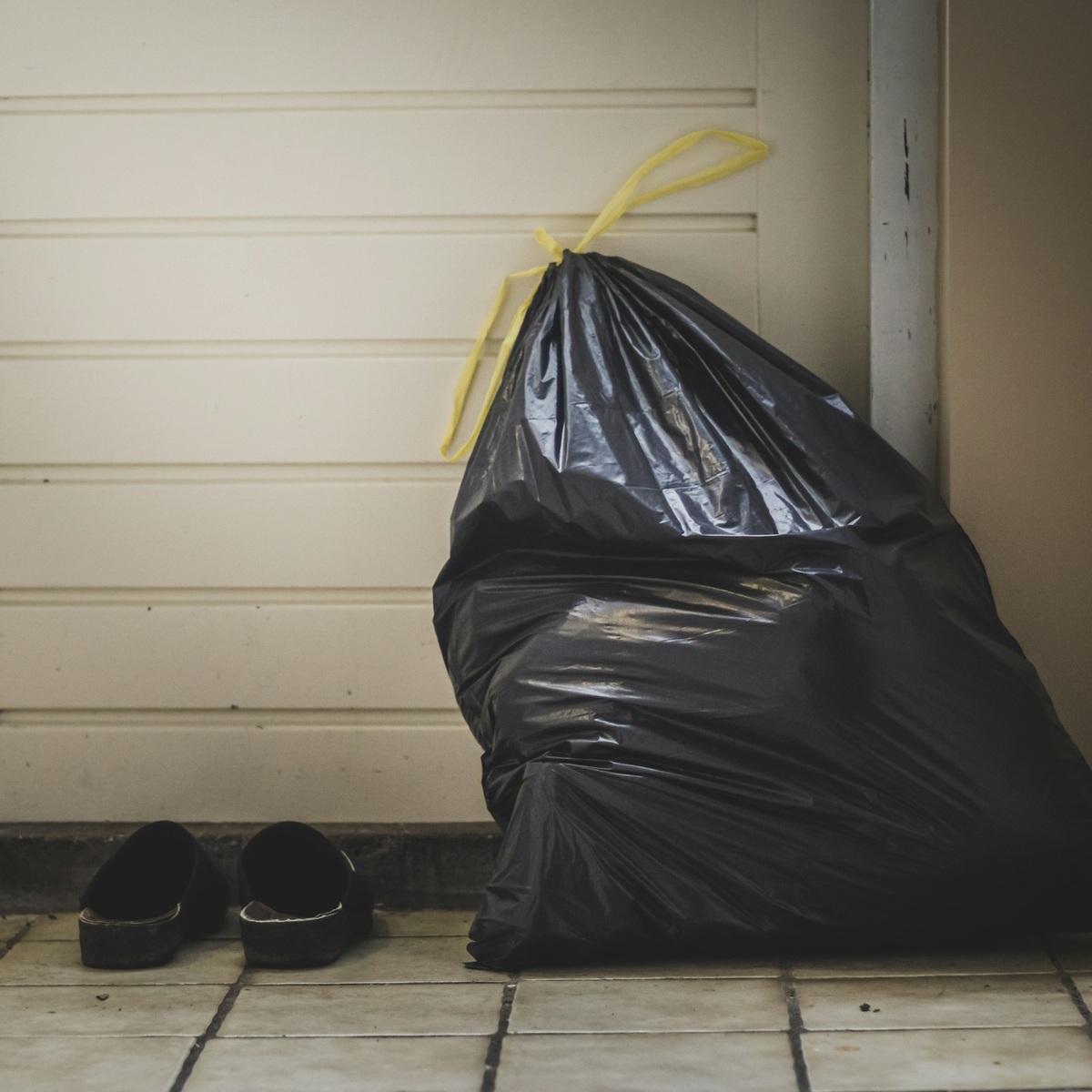 Bag of household waste prepared for residential dumpster disposal near me